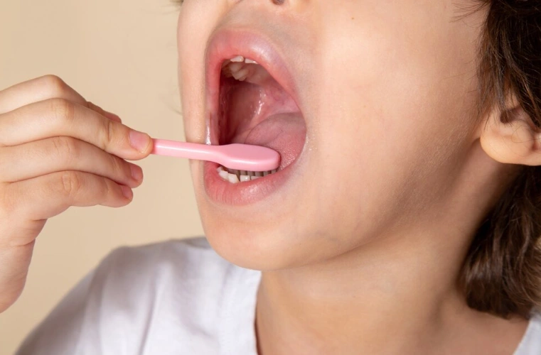 child brushing teeth