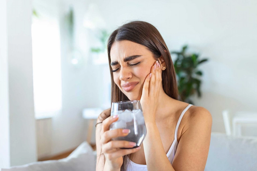 what are the symptoms of tooth sensitivity