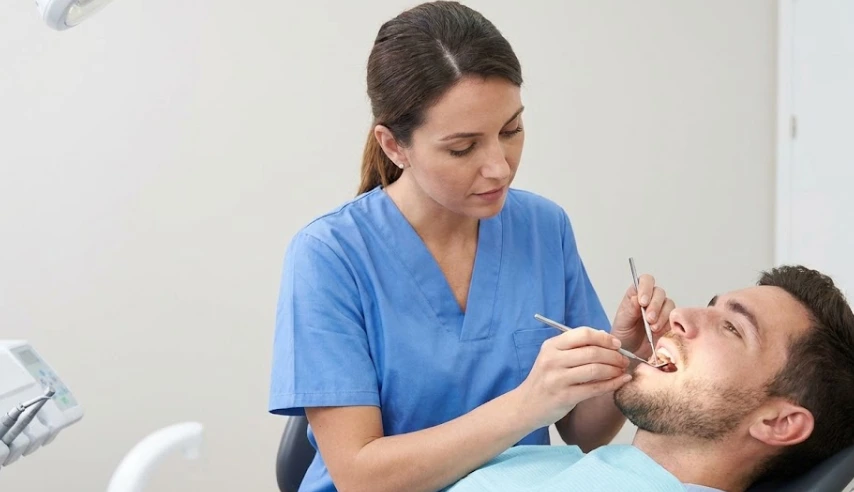 dentist-examining-patients- teeth