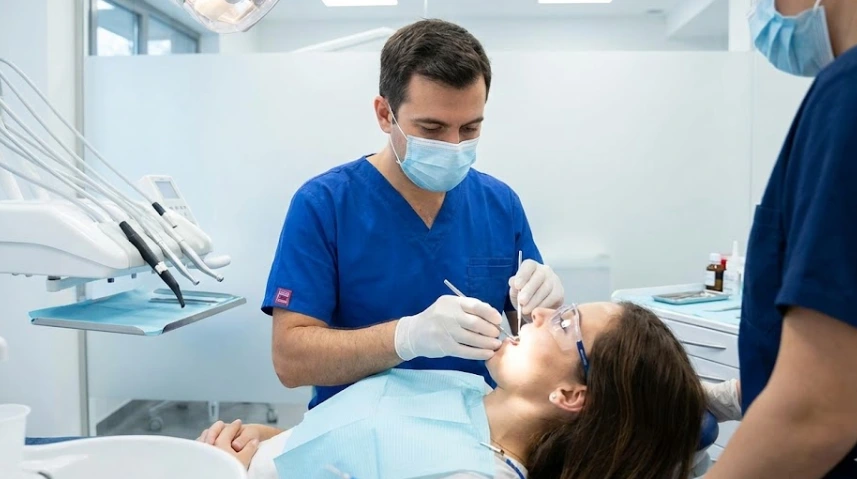 dentist-treating-patient-in-modern-clinic