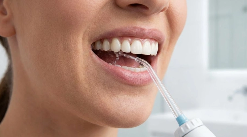 water-flossing-under-implant-bridge