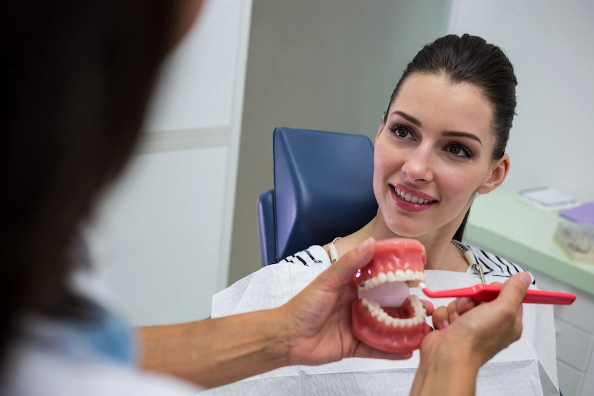 dentist consulting patient full mouth dental implant lema dental clinic
