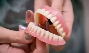 the truth about denture adhesives how much is too much