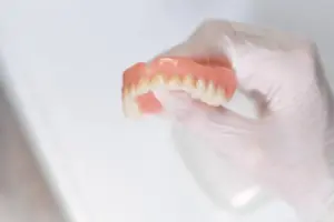 is your tooth loose dont use denture adhesive!
