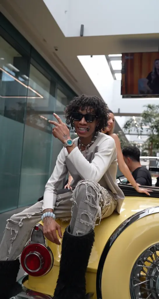 leo posing on vintage yellow car lema dental
